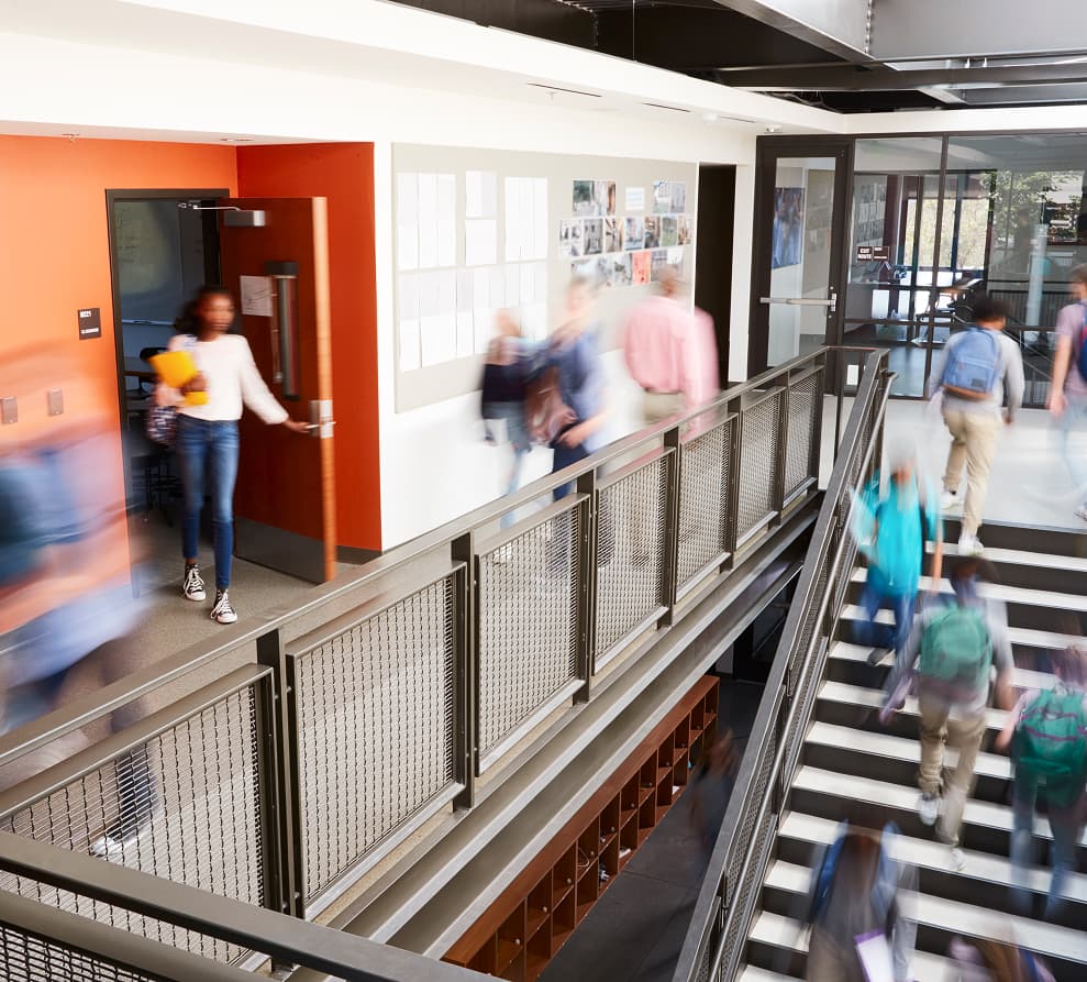 busy_school_corridor_with_blurred_students_and_staff