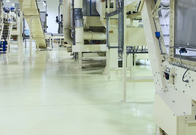Industrial flooring with heavy equipment.