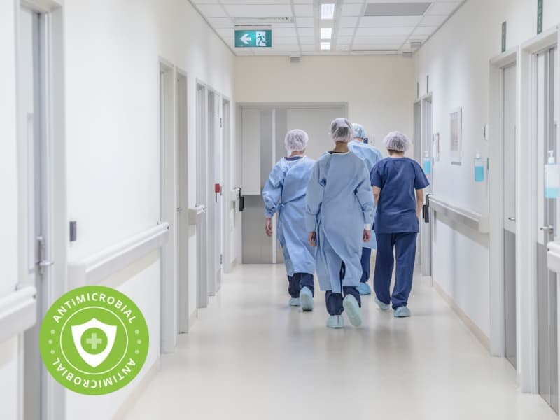 view_from_behind_of_four_doctors_in_hospital_walking_away_from_camera
